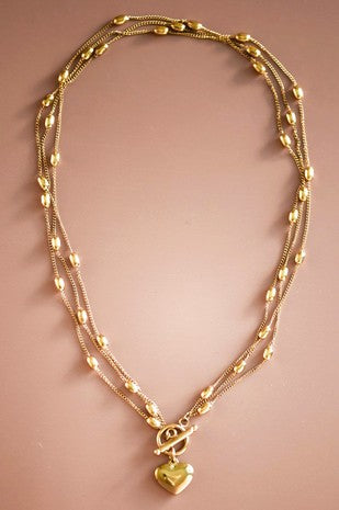 Collar triple corazón dorado