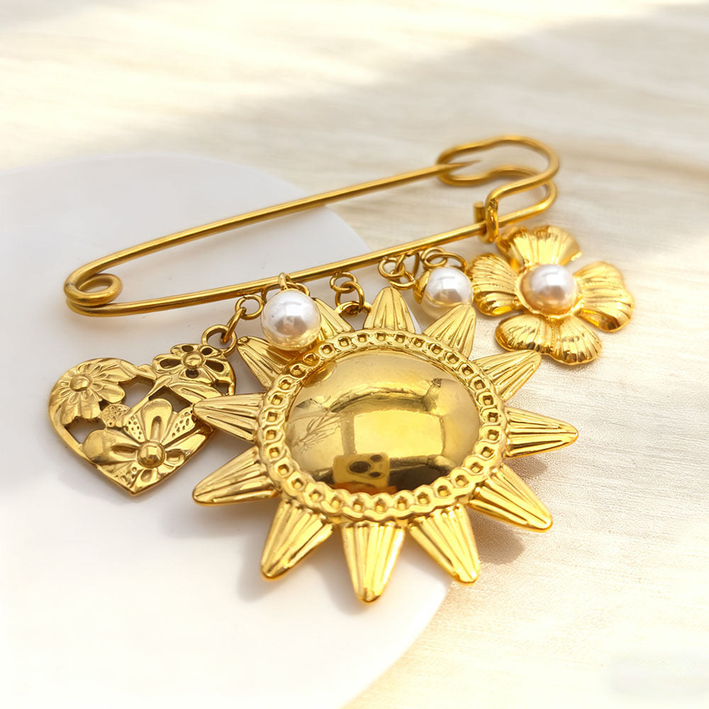 Pin dorado sol