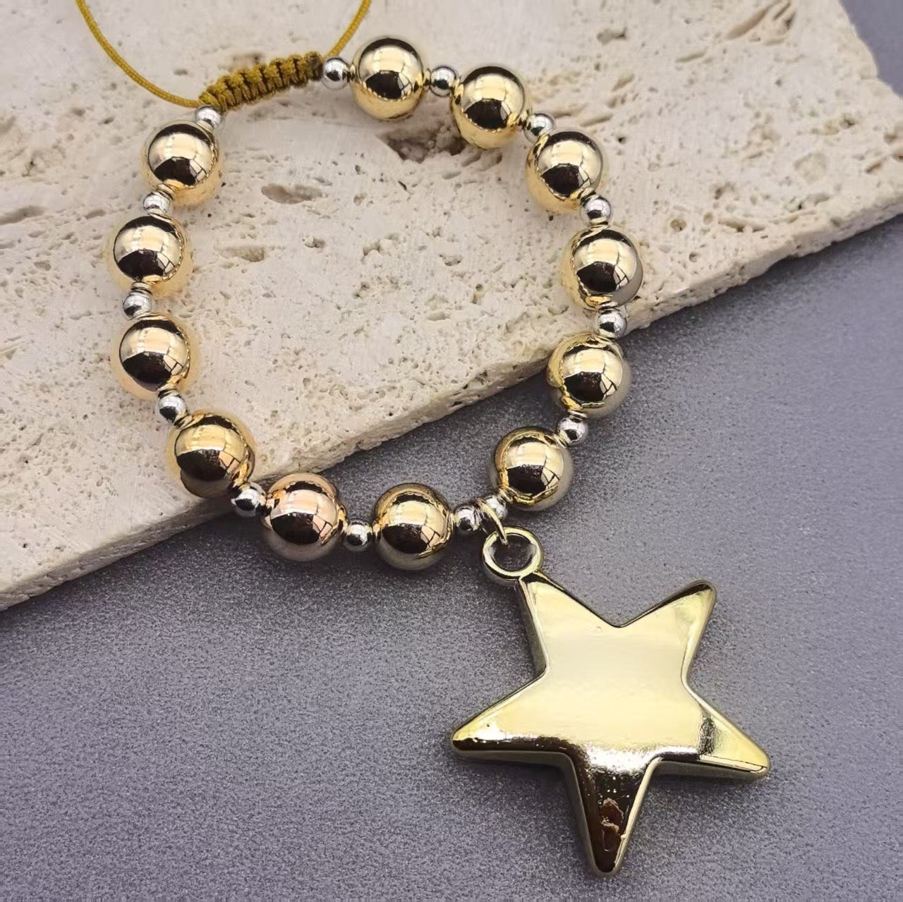 Pulsera estrella dorada