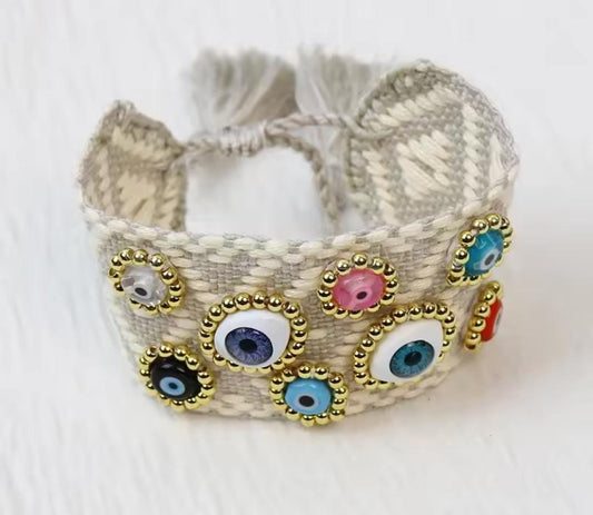 Pulsera hilo gris ojos