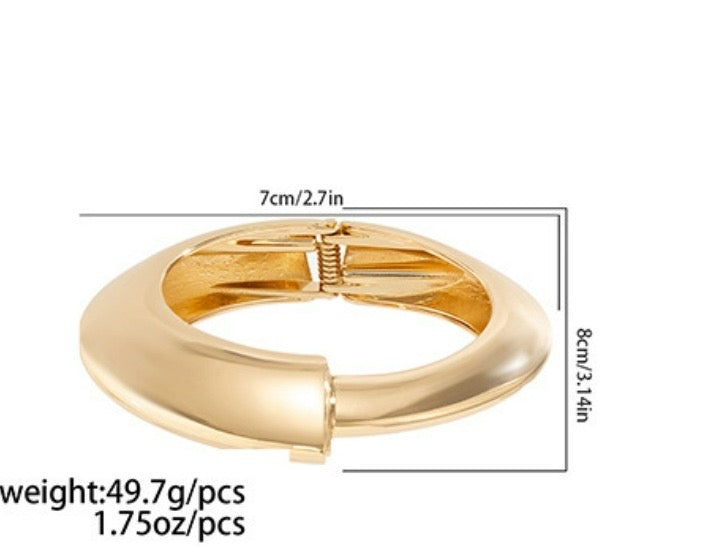Brazalete dorado asimetrico