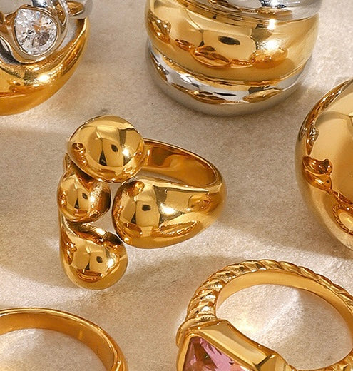 Anillo dorado cuatro bolitas