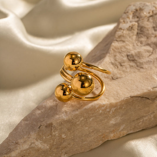 Anillo dorado tres bolitas