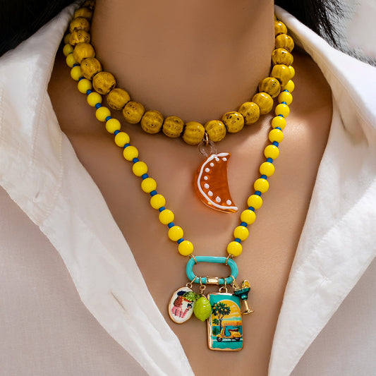 Collar bolitas y charm