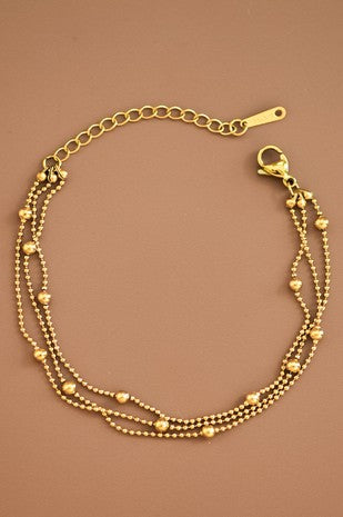 Pulsera triple bolitas